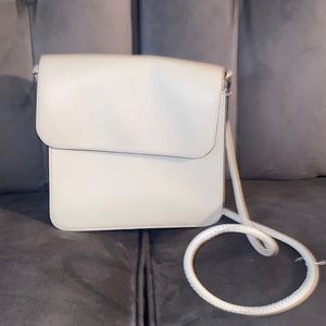 Loeffler Randall- ivory  crossbody good condition strap was repaired.